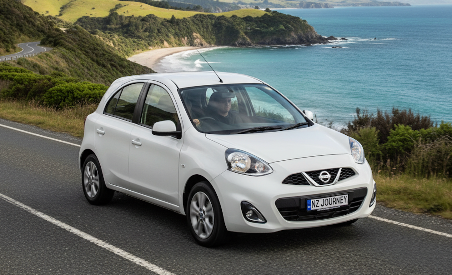 White Nissan March on a New Zealand road