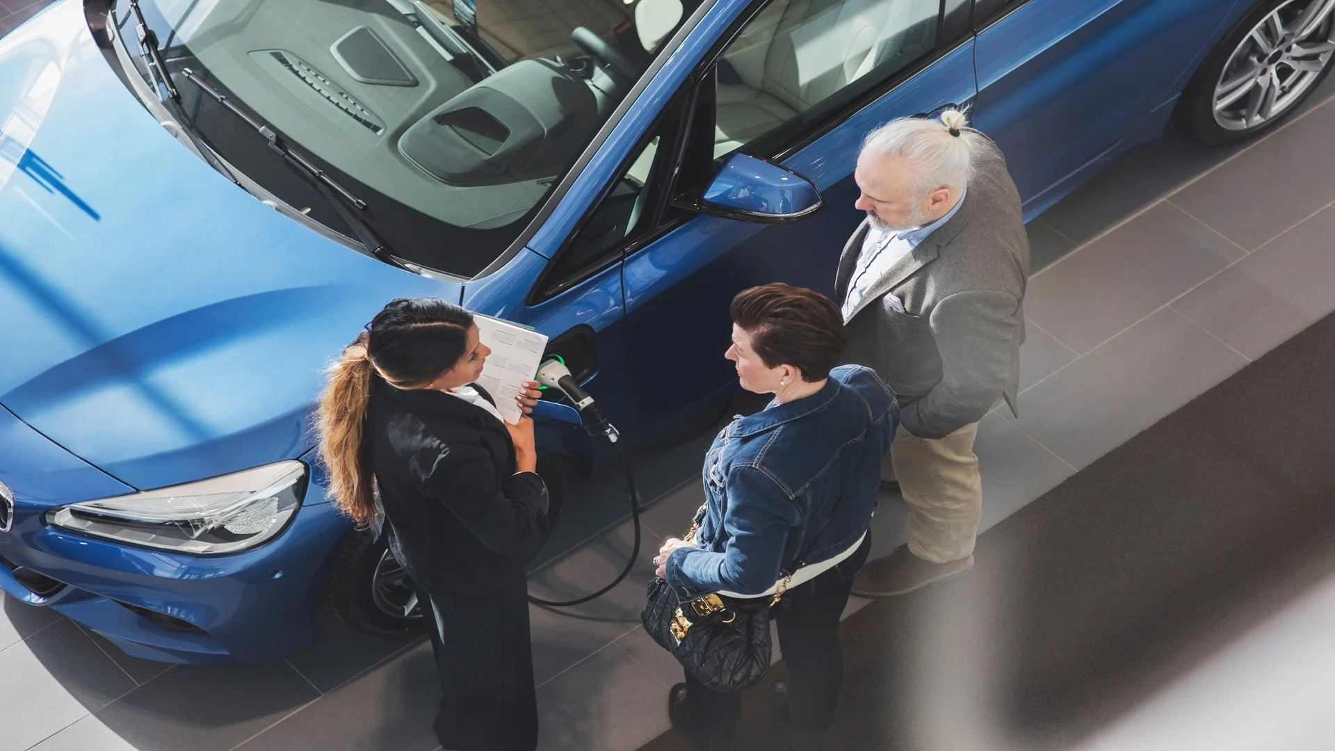 Couple in car dealership