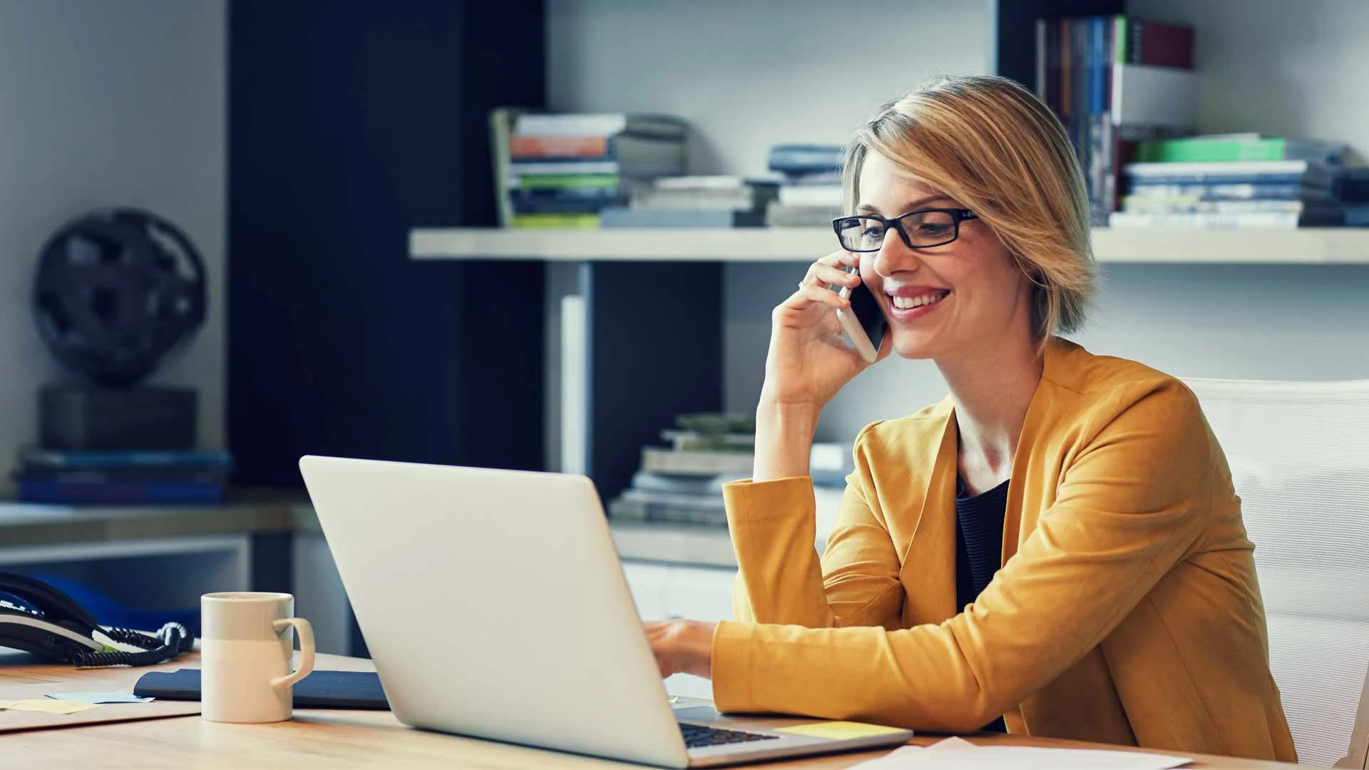 Business person on phone talking to candidate.