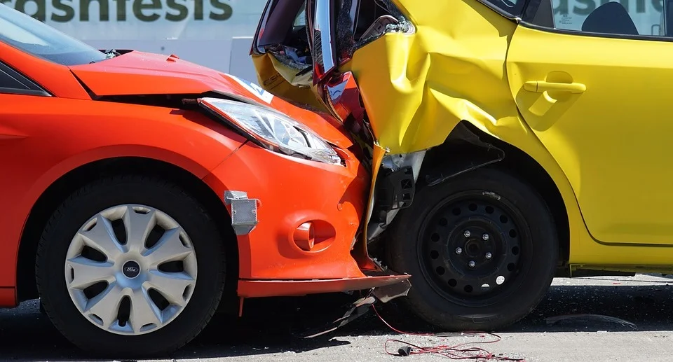 an orange car and a yellow car