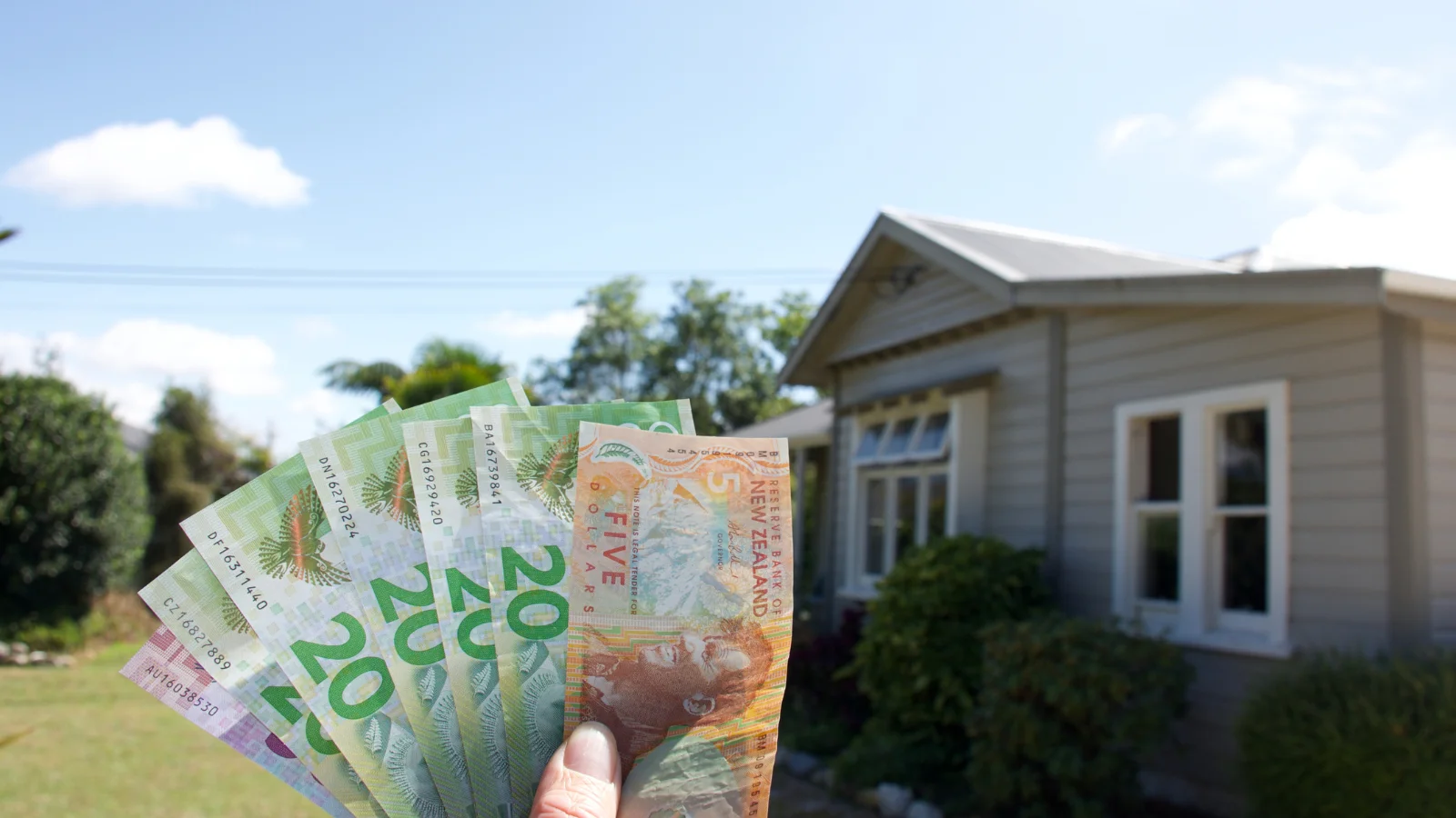 Cash in front of house.