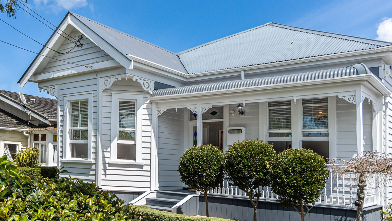 White villa with a light grey roof