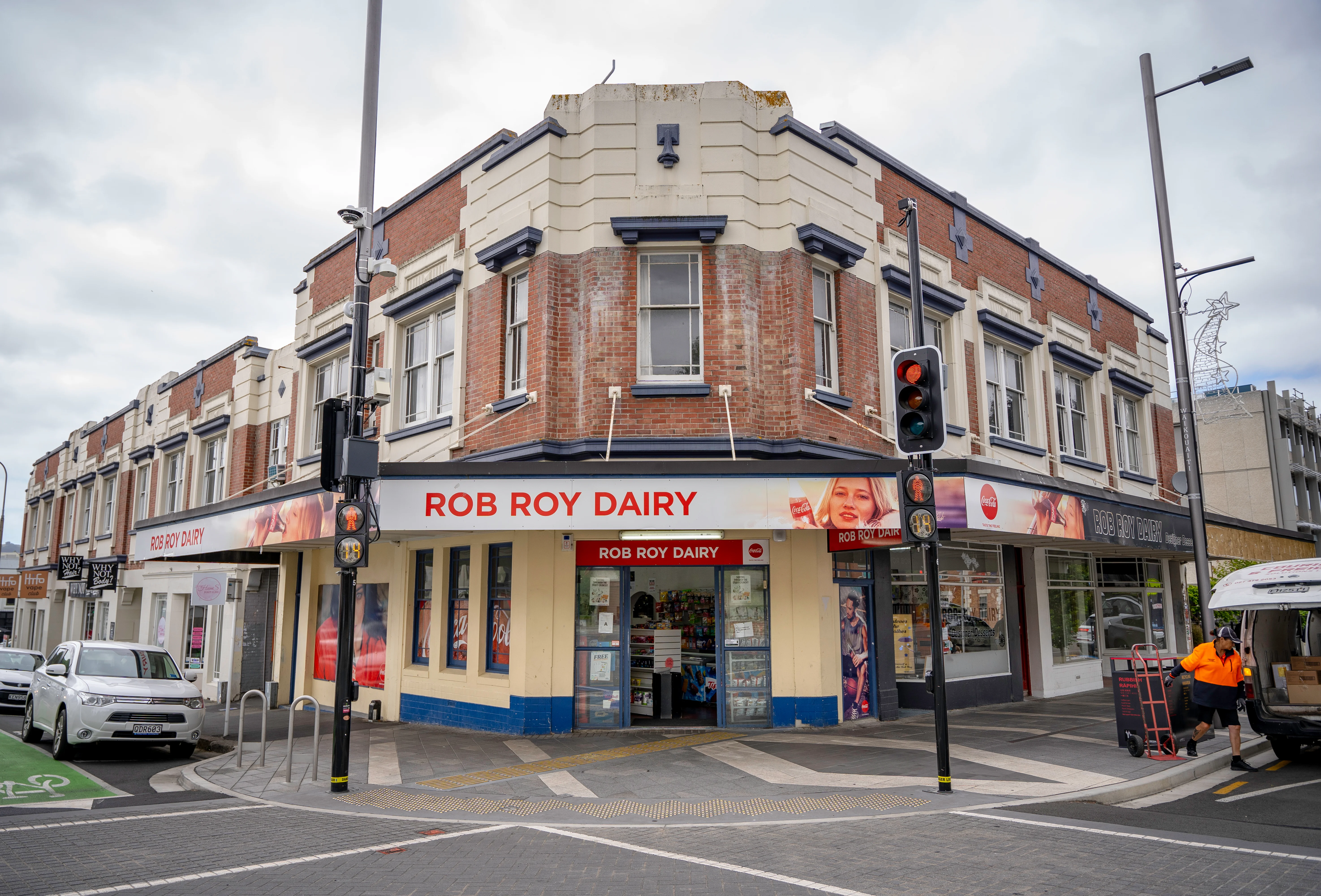 A dairy (shop) stands on the corner of the street