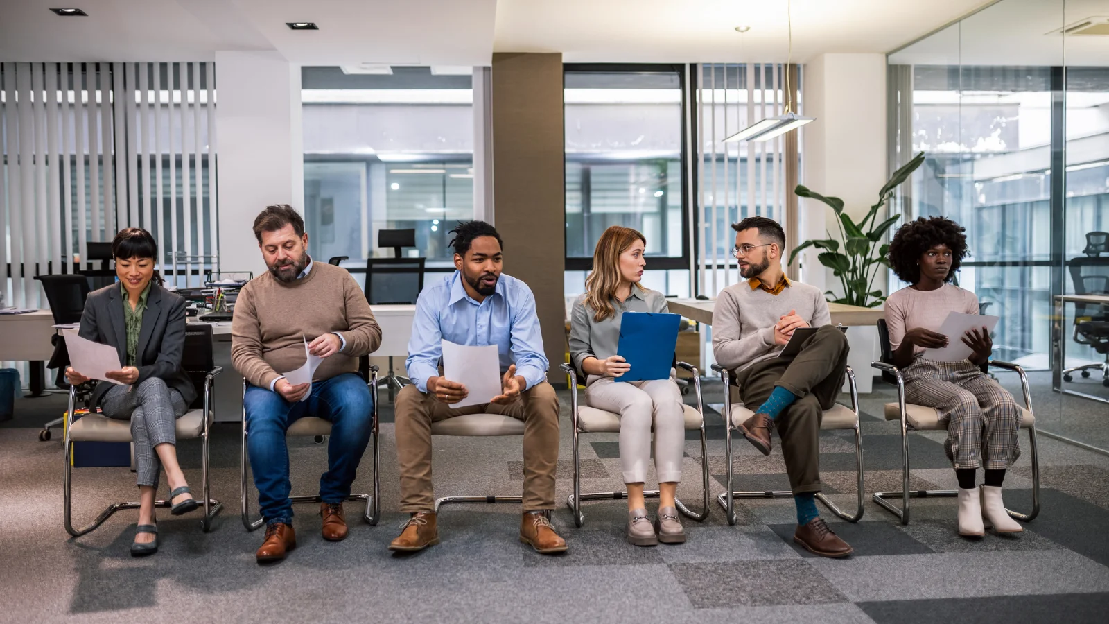 Shortlist of candidates waiting outside office. 