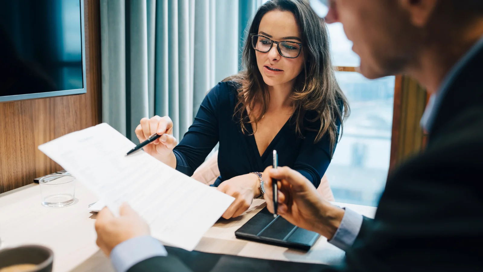 Lawyer showing document to client.