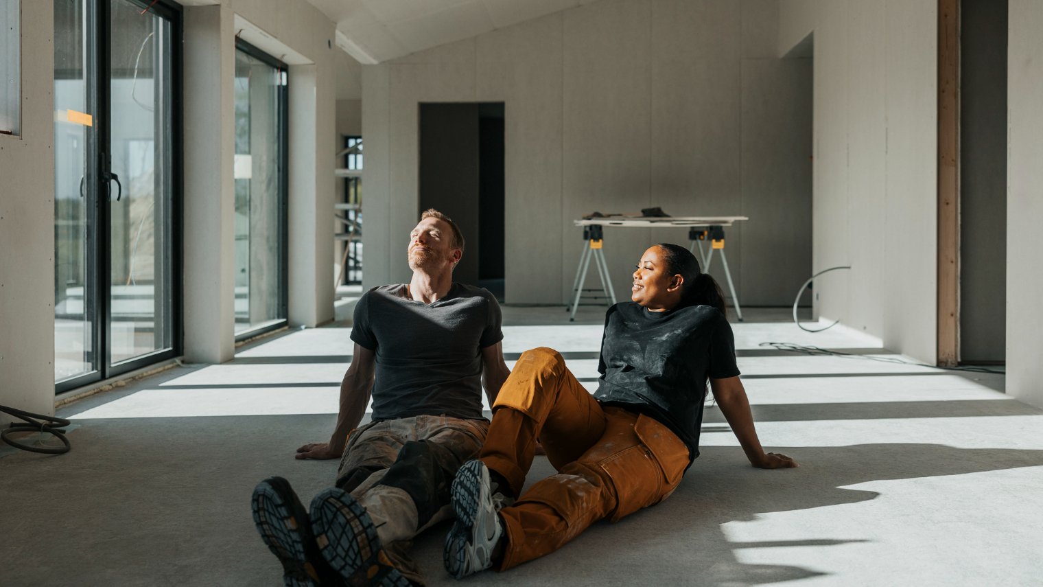 Two people looking at their home renovation