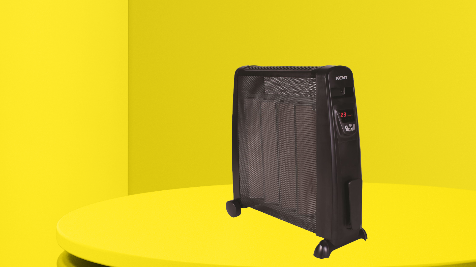 A black micathermic heater on a circular yellow plinth and yellow background