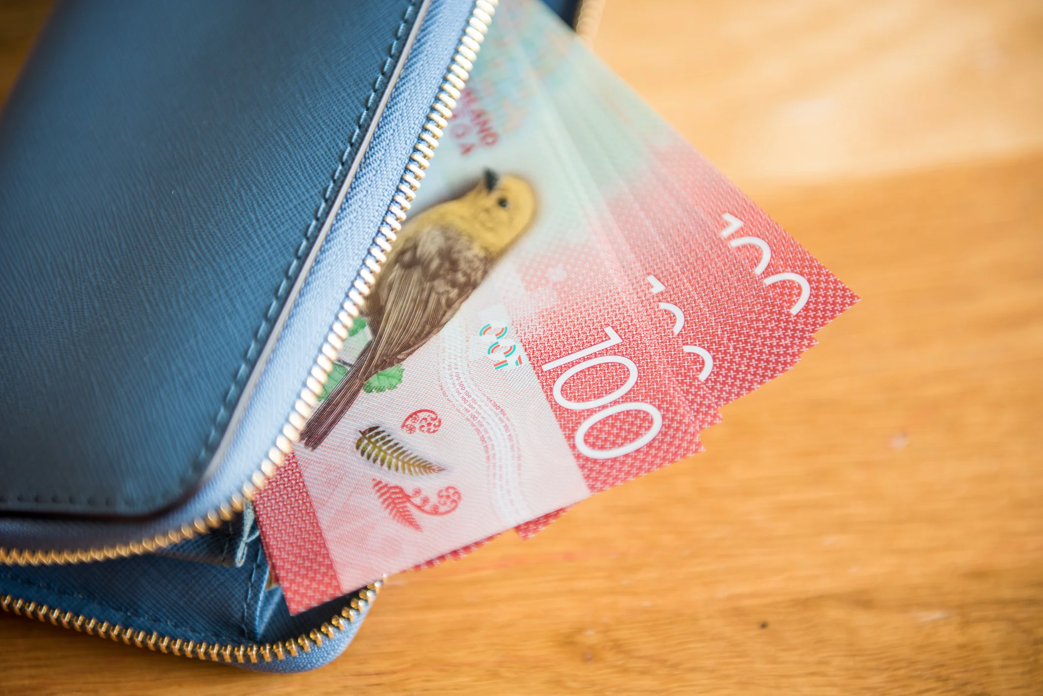 Wallet with $100 NZD poking out