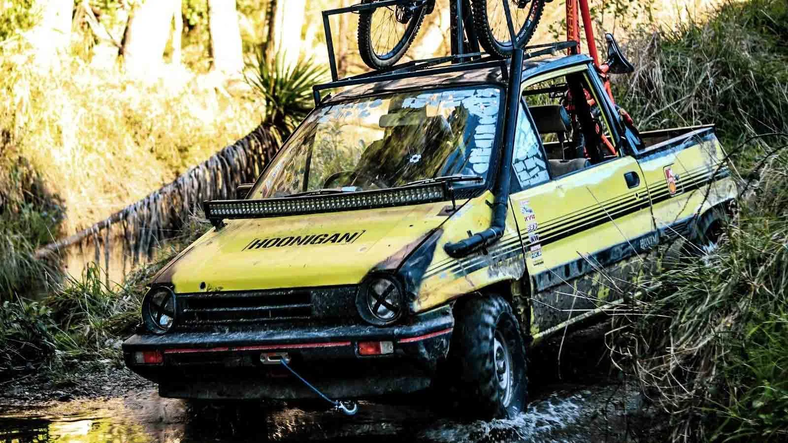 1986 Honda City takes to the dirt with mountain bikes propped up in the DIY truck bed.