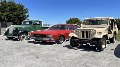 A Jeep, Mitsubishi and Holden lined up