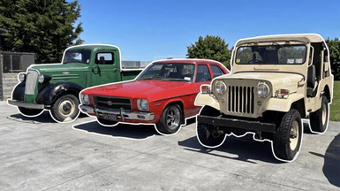 A Jeep, Mitsubishi and Holden lined up