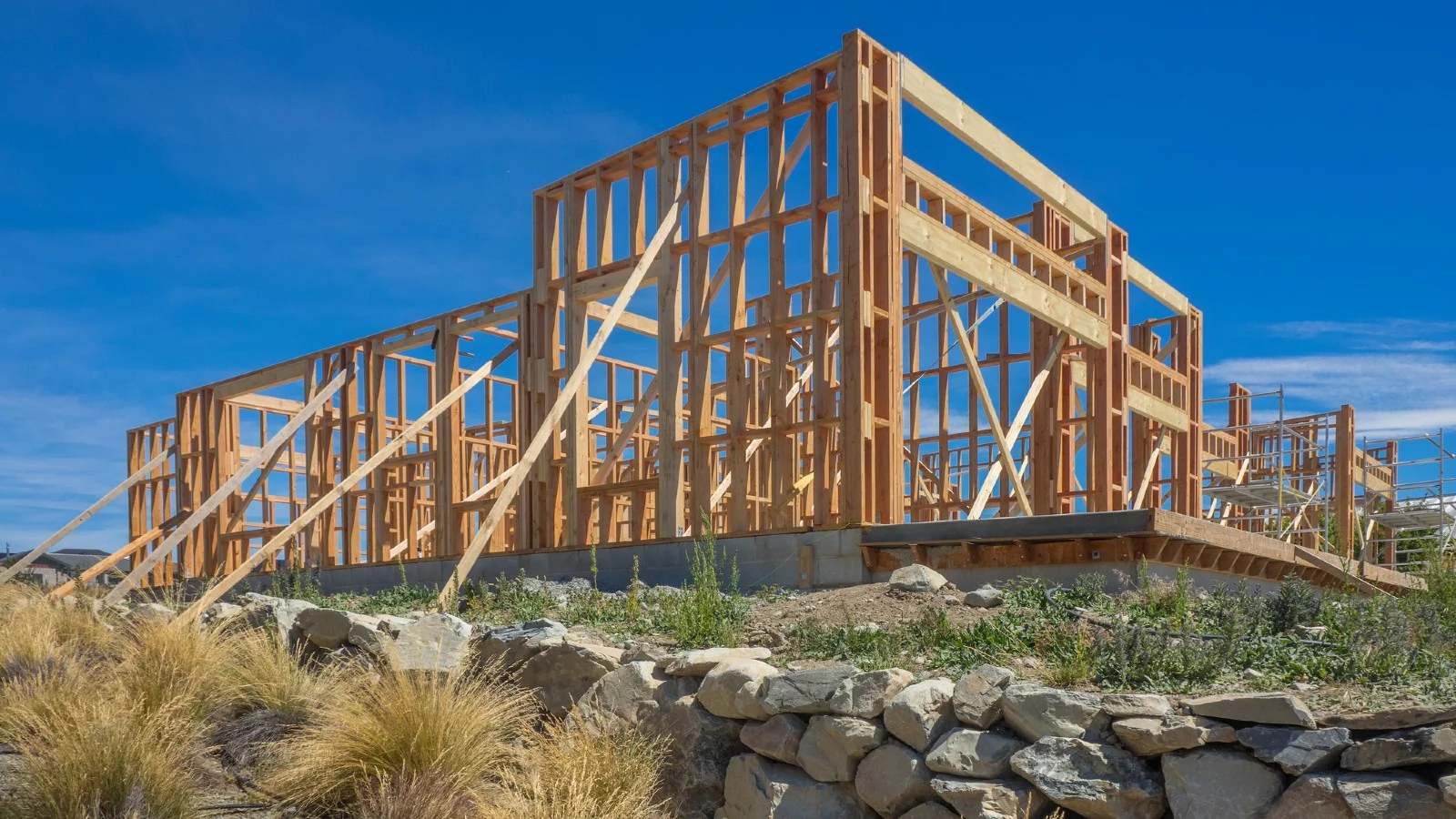 Image of house frame against blue sky.