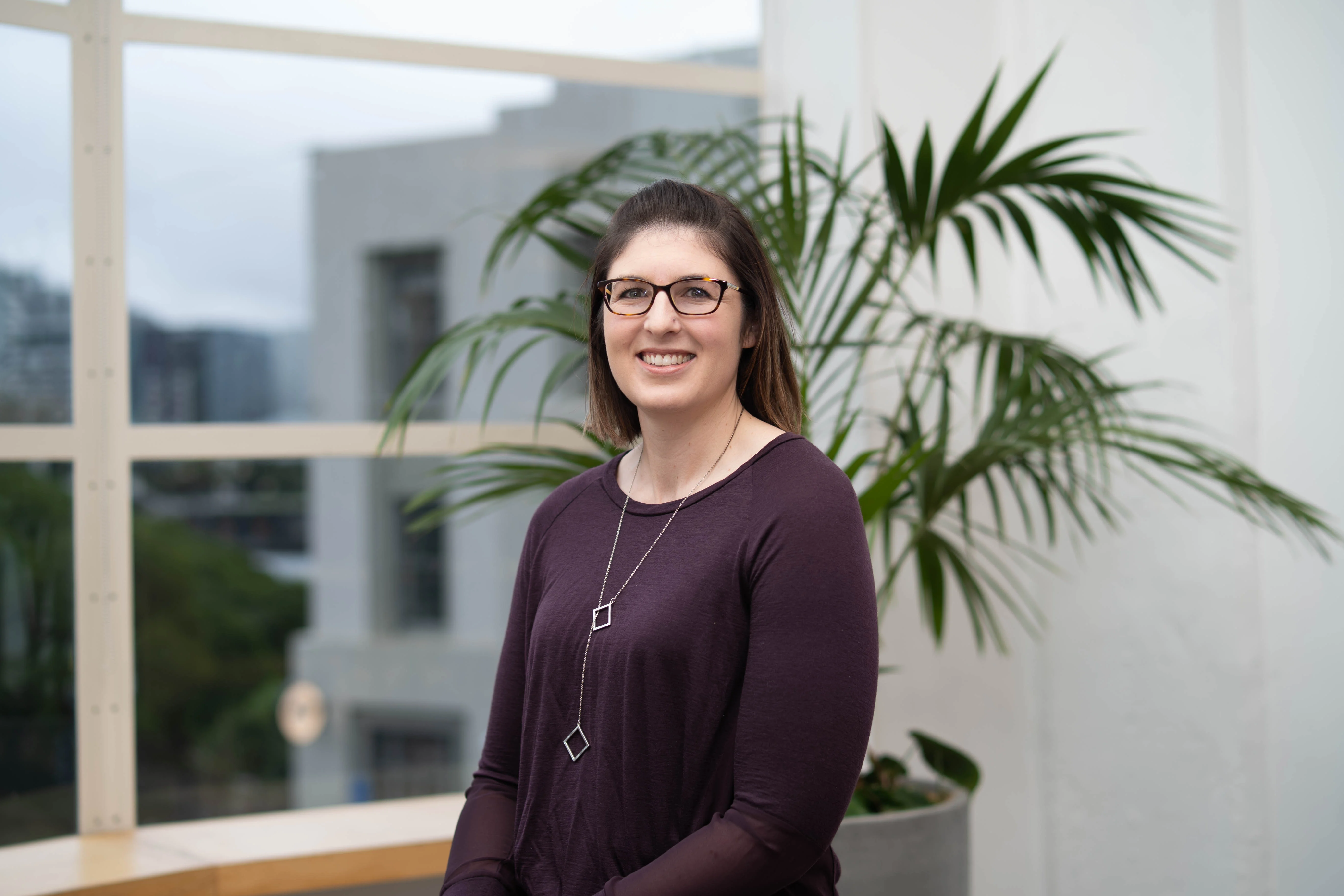 Young woman in cafe listening to coversation.