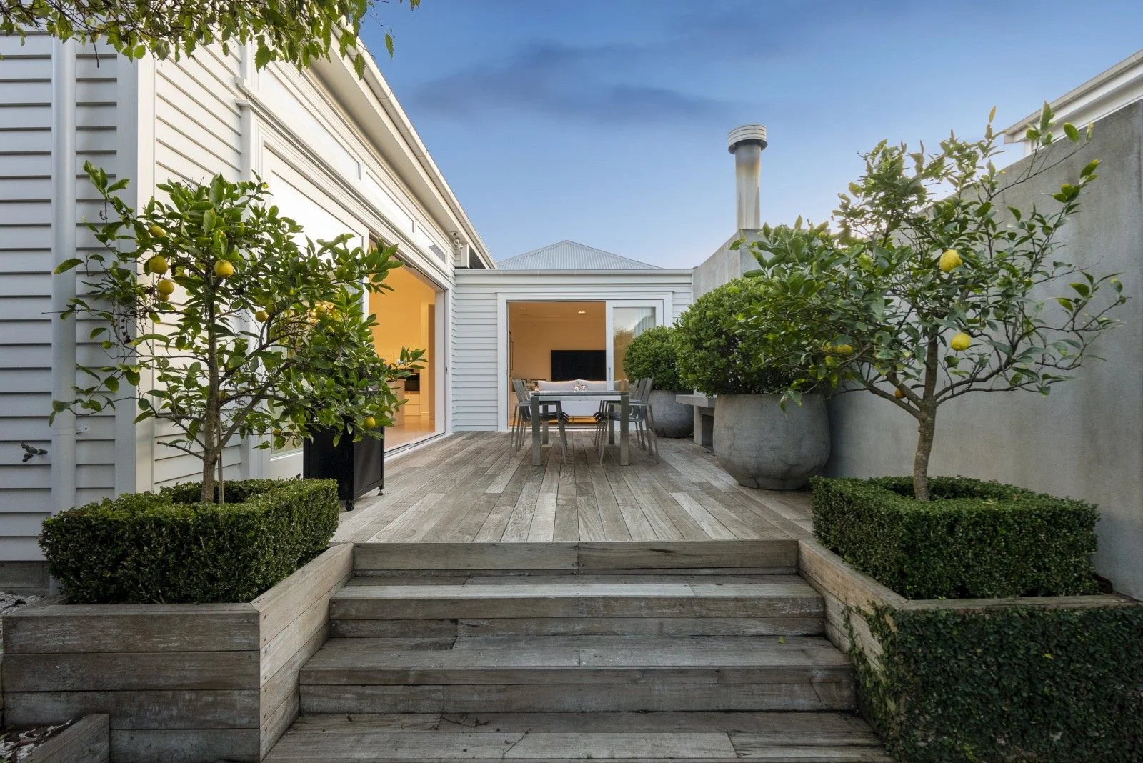 Courtyard with lemon trees and outdoor table 