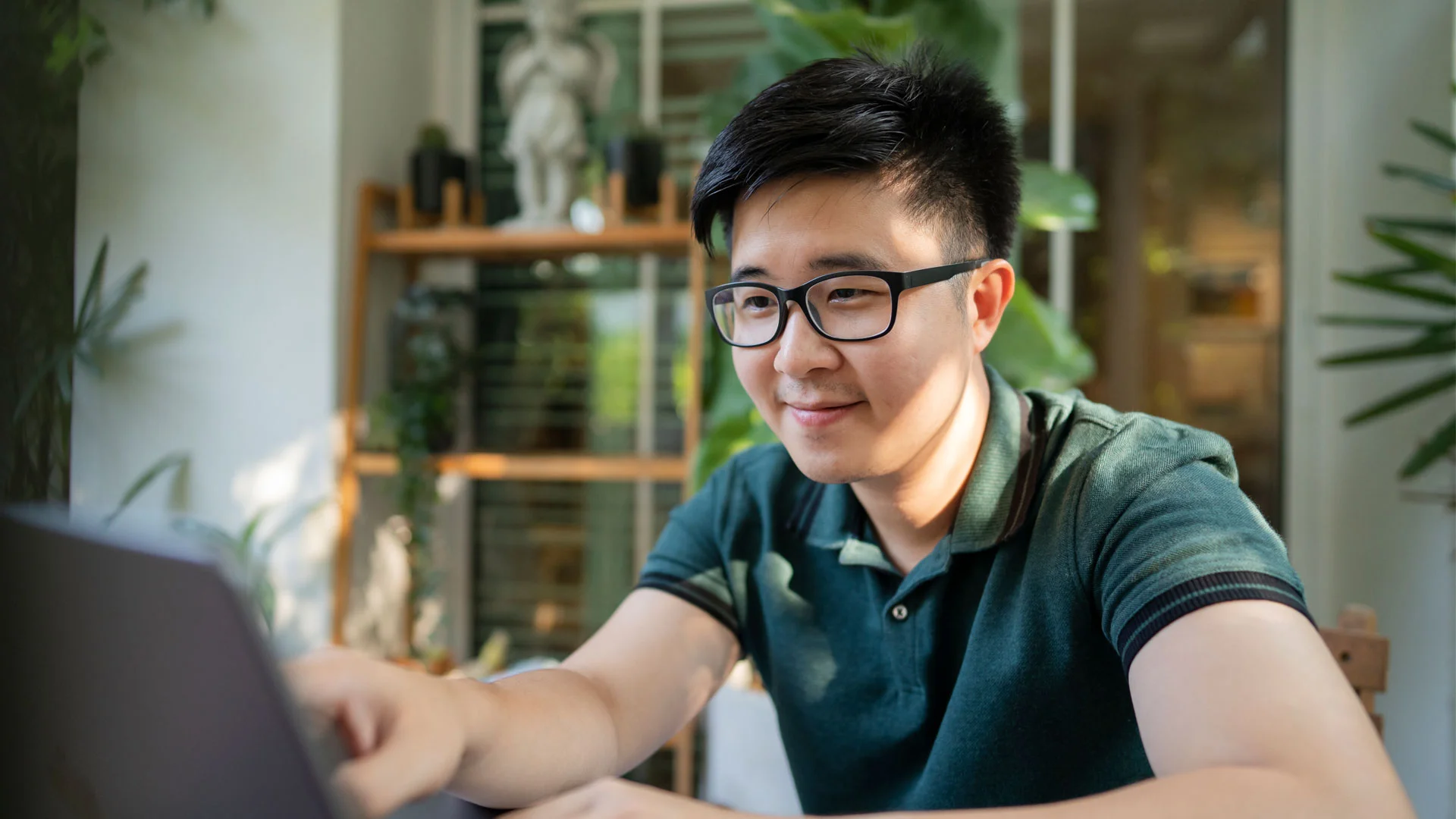 Young man checking his cover letter before submitting it to a job applicaiton.