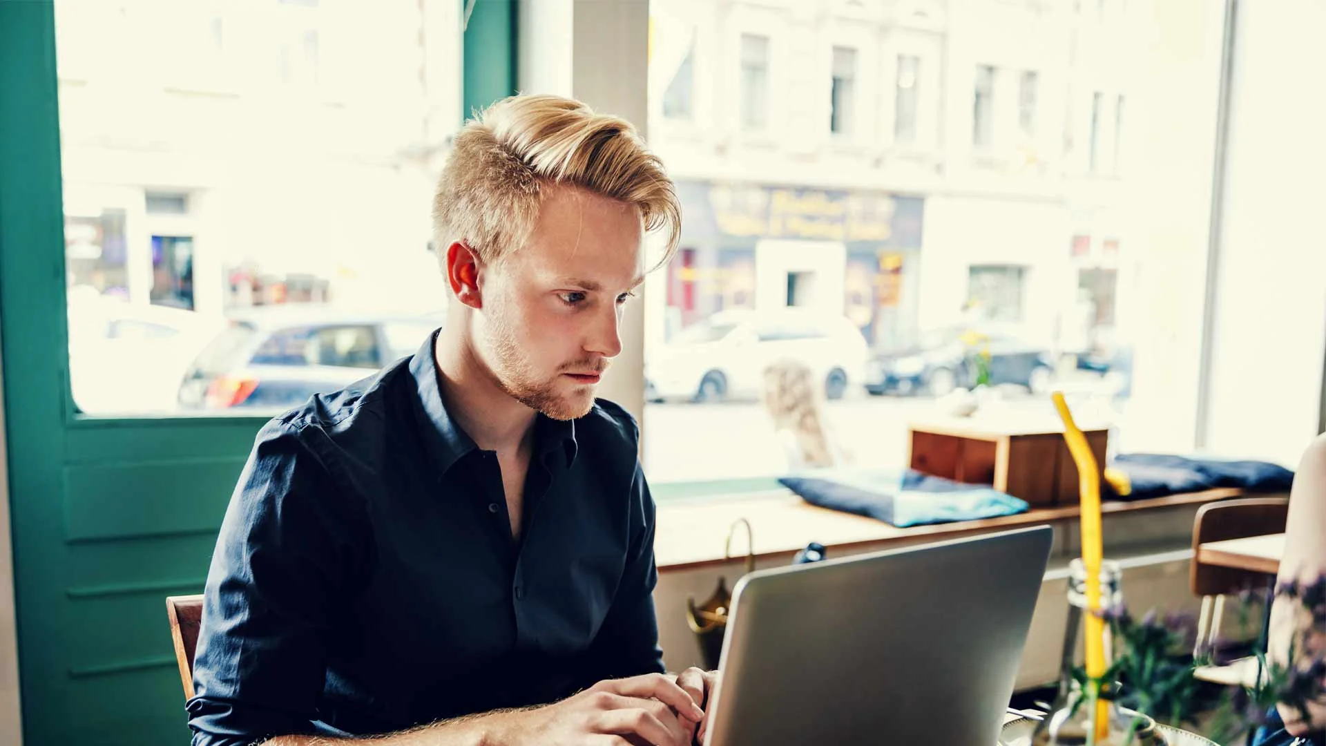 Applicant researching an appropriate salary on his laptop.