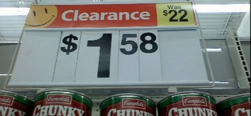 Supermarket 'Clearance' sale sign offering a discount price of $1.58 down from $22 for Campbells chunky soup