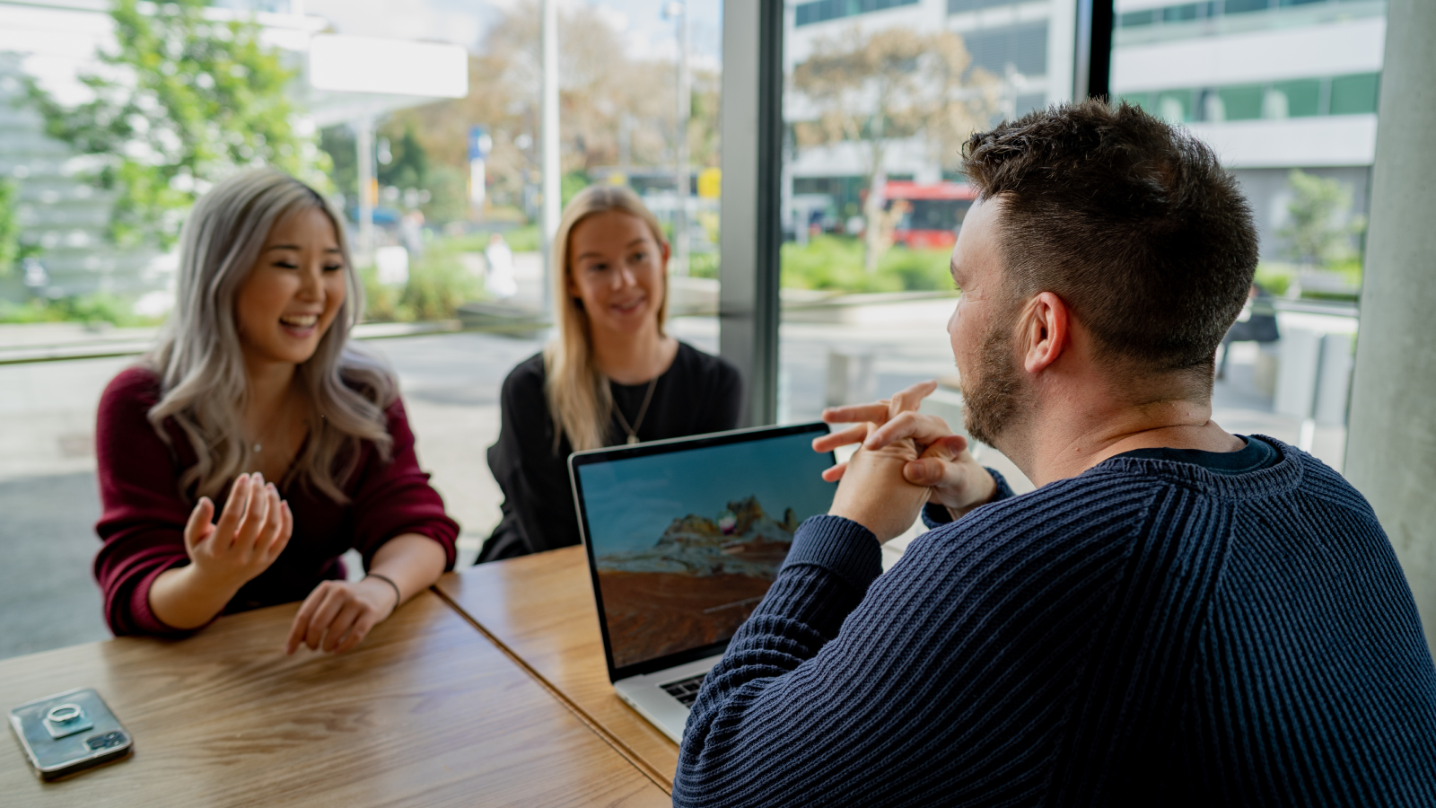 Colleagues sitting in a coffee shop