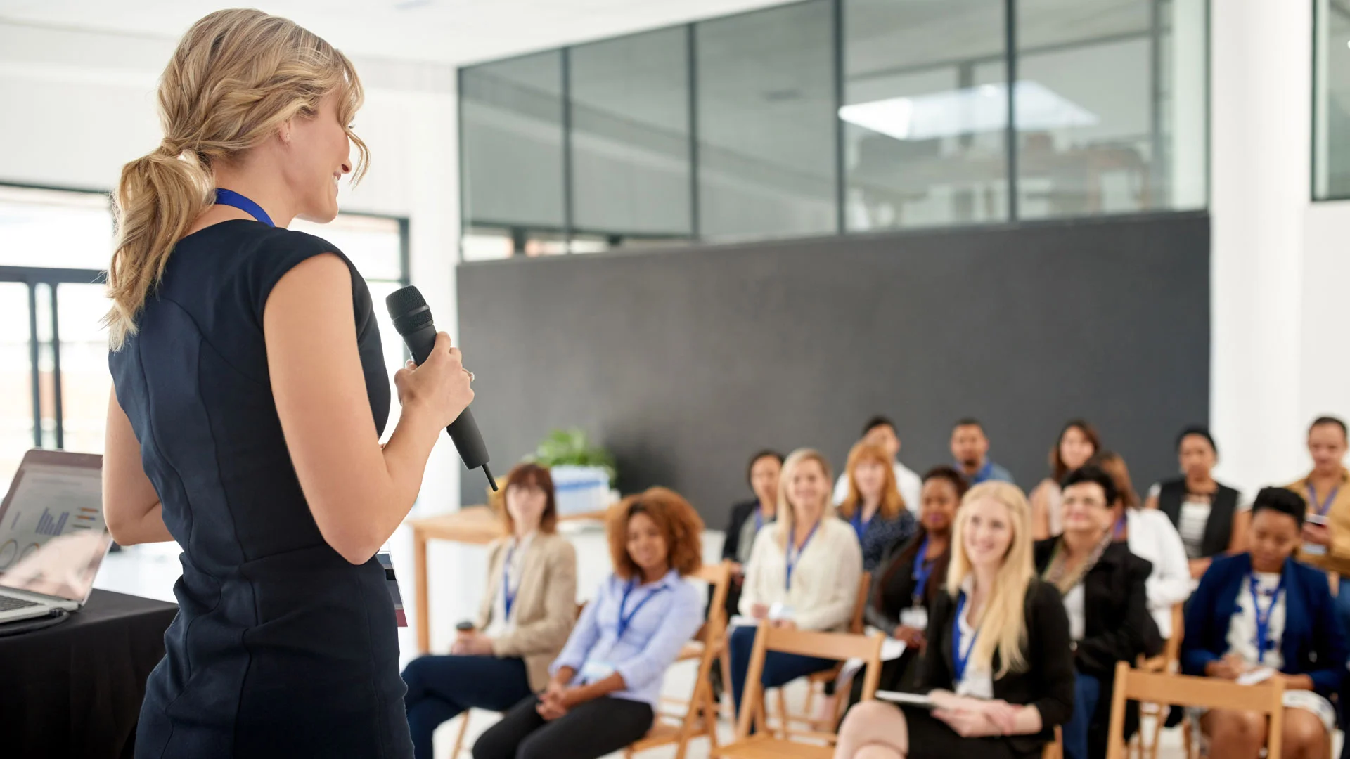 Female business leader giving a presentation.