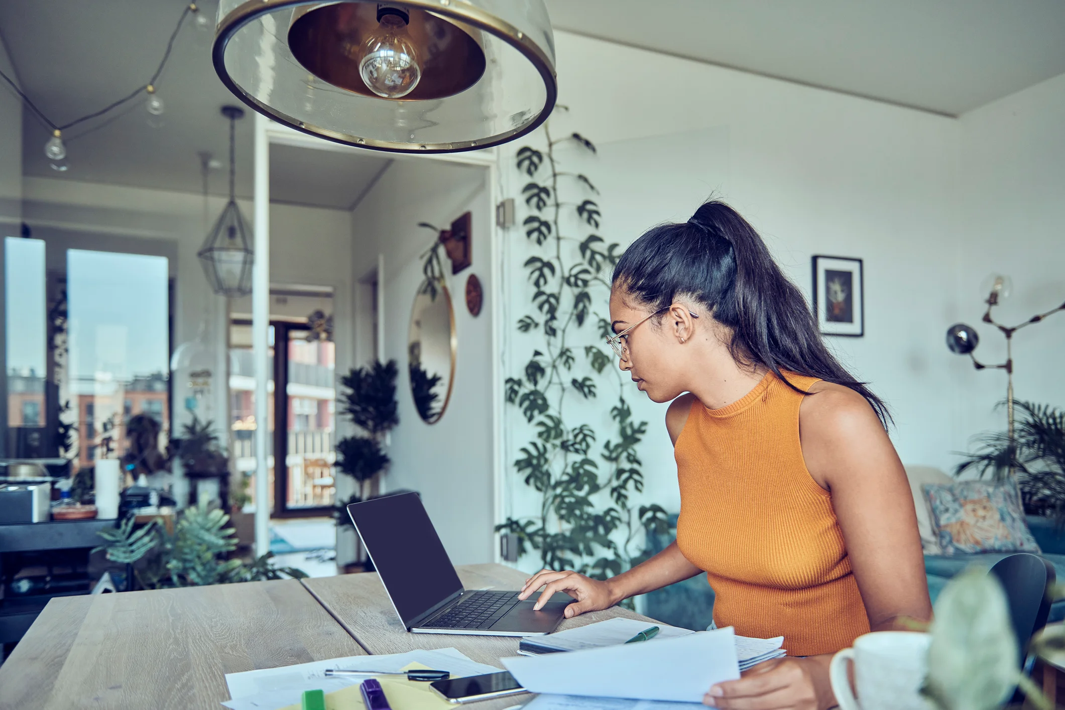 Woman checking tenancy rules for rent increases in NZ.