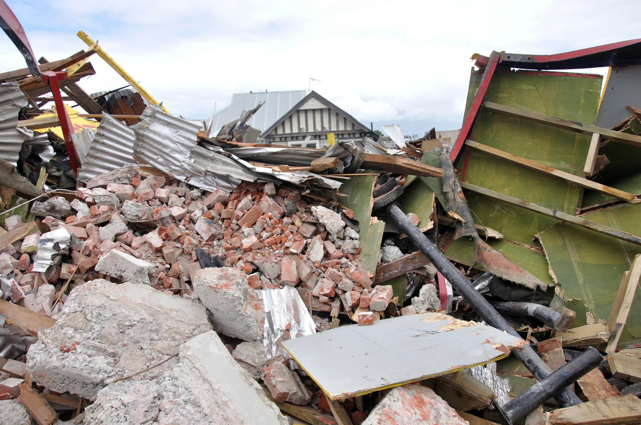 House rubble piled up from the earthquake in Christchurch, South Island, New Zealand