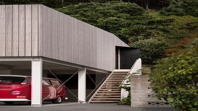 Front view of the home with the architectural features including the steel portal frames. 