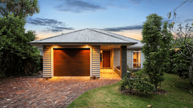 Eco-home lit up with solar panels