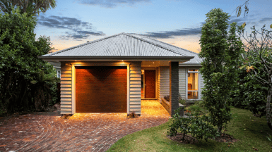 Eco-home lit up with solar panels