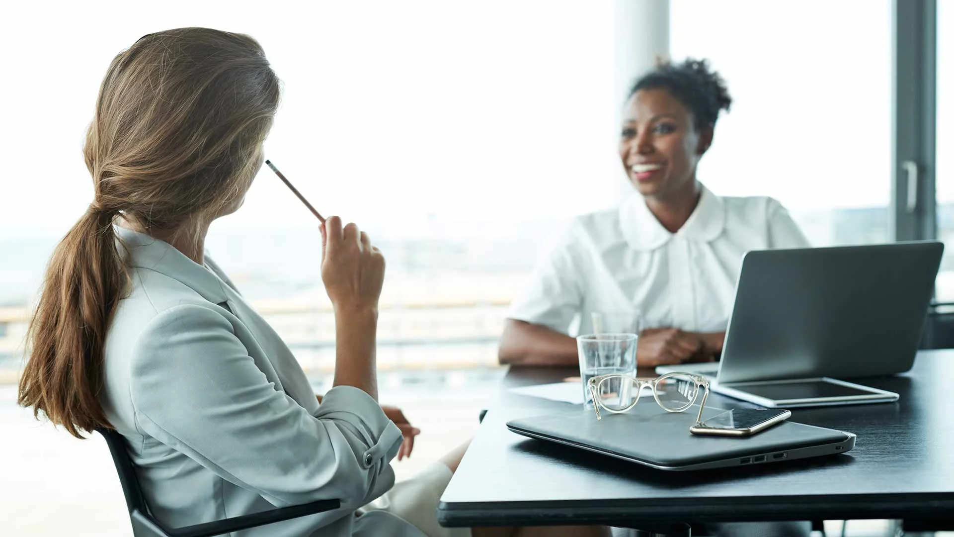 Businesswoman asking manager for time off.