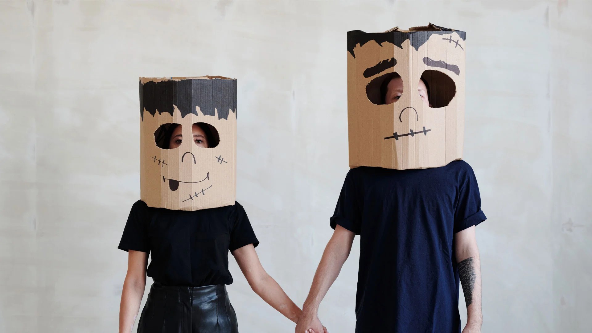 Parent and child dressed in Frankenstein costumes for Halloween.