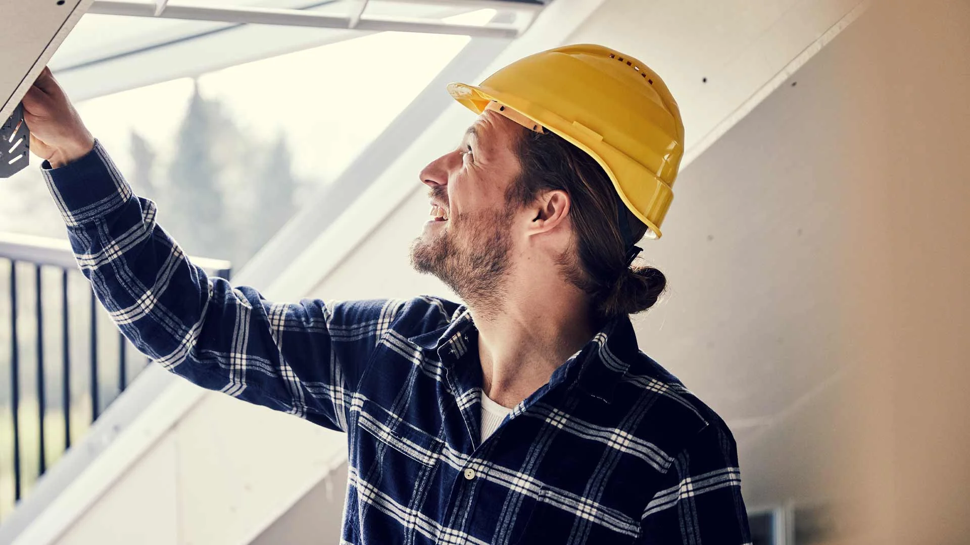 Builder conducting a builder's report on a property in New Zealand.