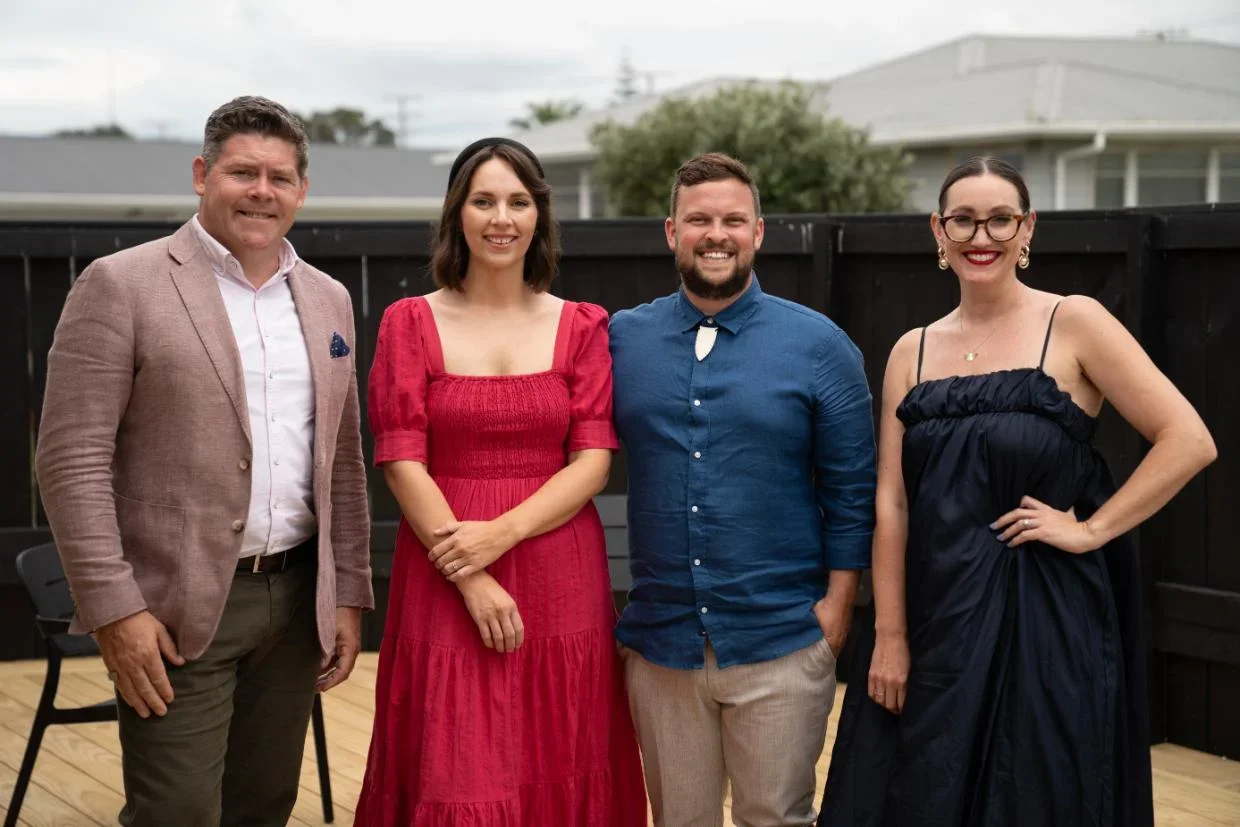 Home owners pictured with agent and interior designer