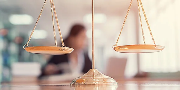 Weighing scales sitting on a desk.