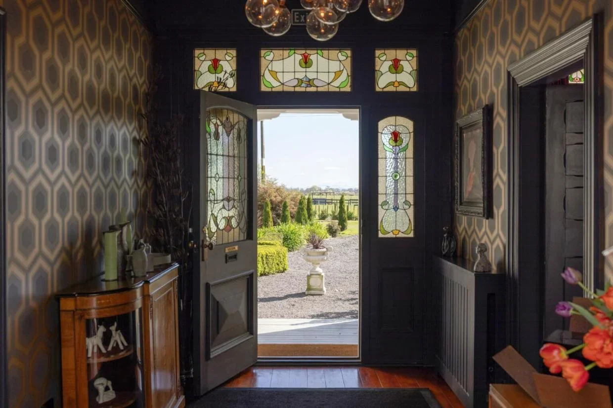 A grand stained glass entry to Hawthorne House.