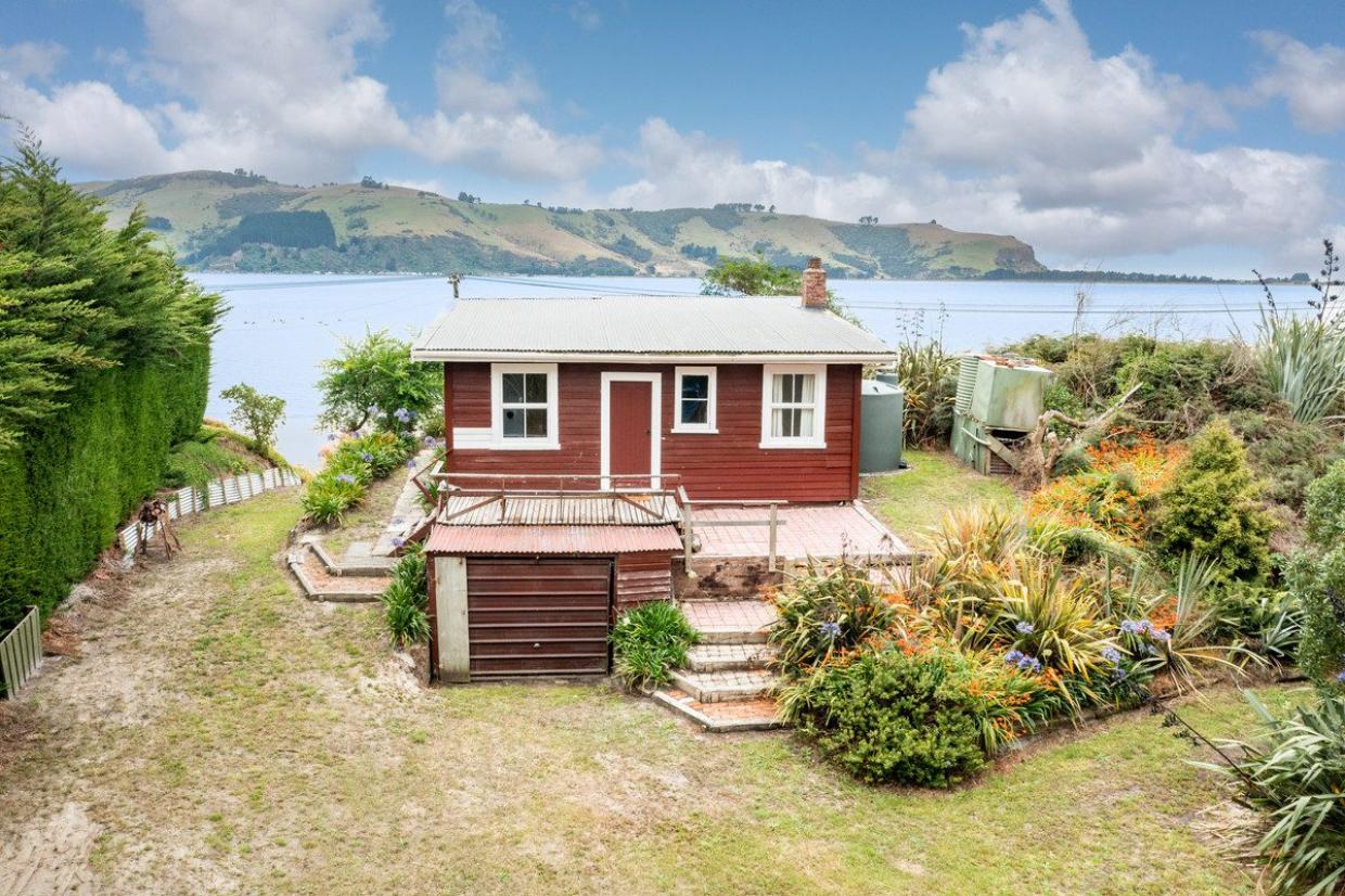 This little seaside cottage is on the market for under $300k, but there is a catch. Photo: TRADE ME/LJ HOOKER