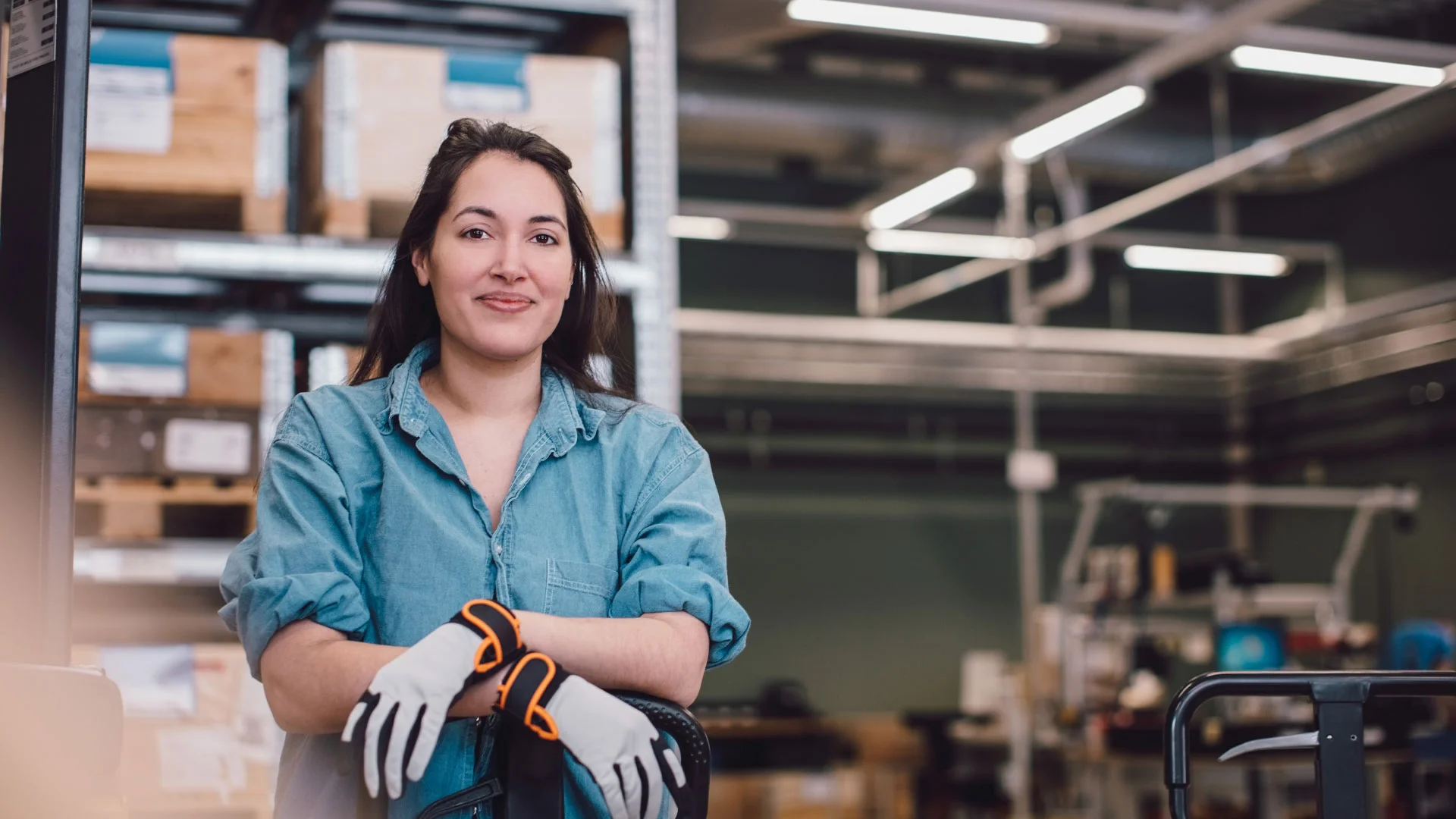 Female warehouse employee looking at the camera.