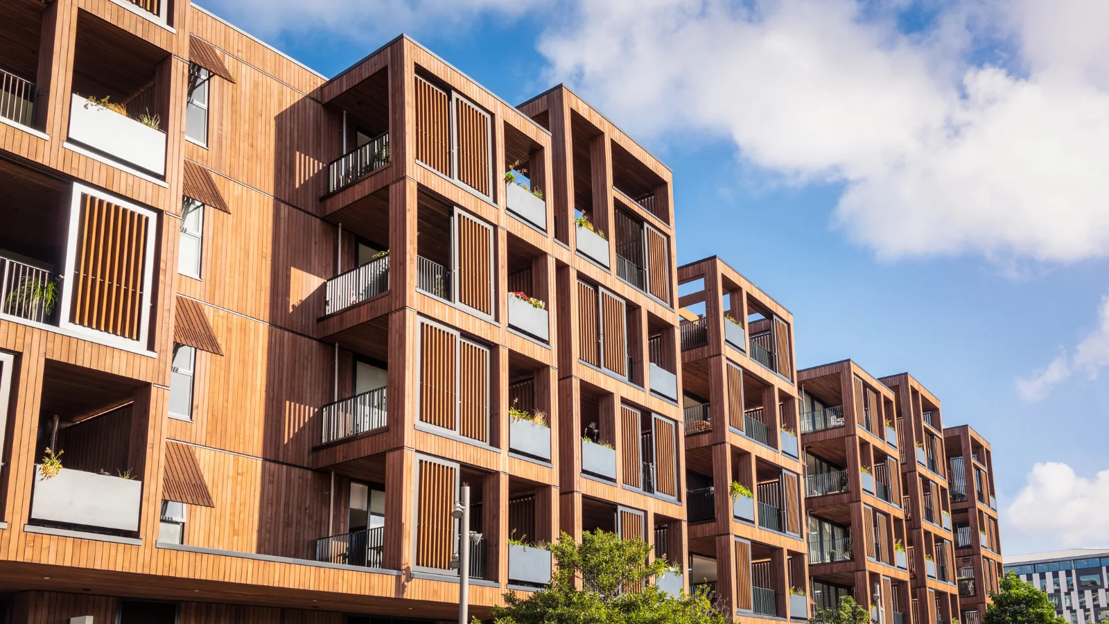 Apartment block against blue sky.