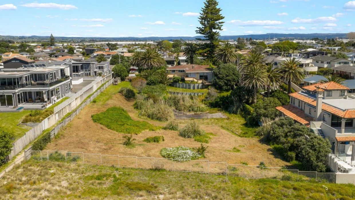 A fence defines the boundary between the Beazley land and the sand dunes.