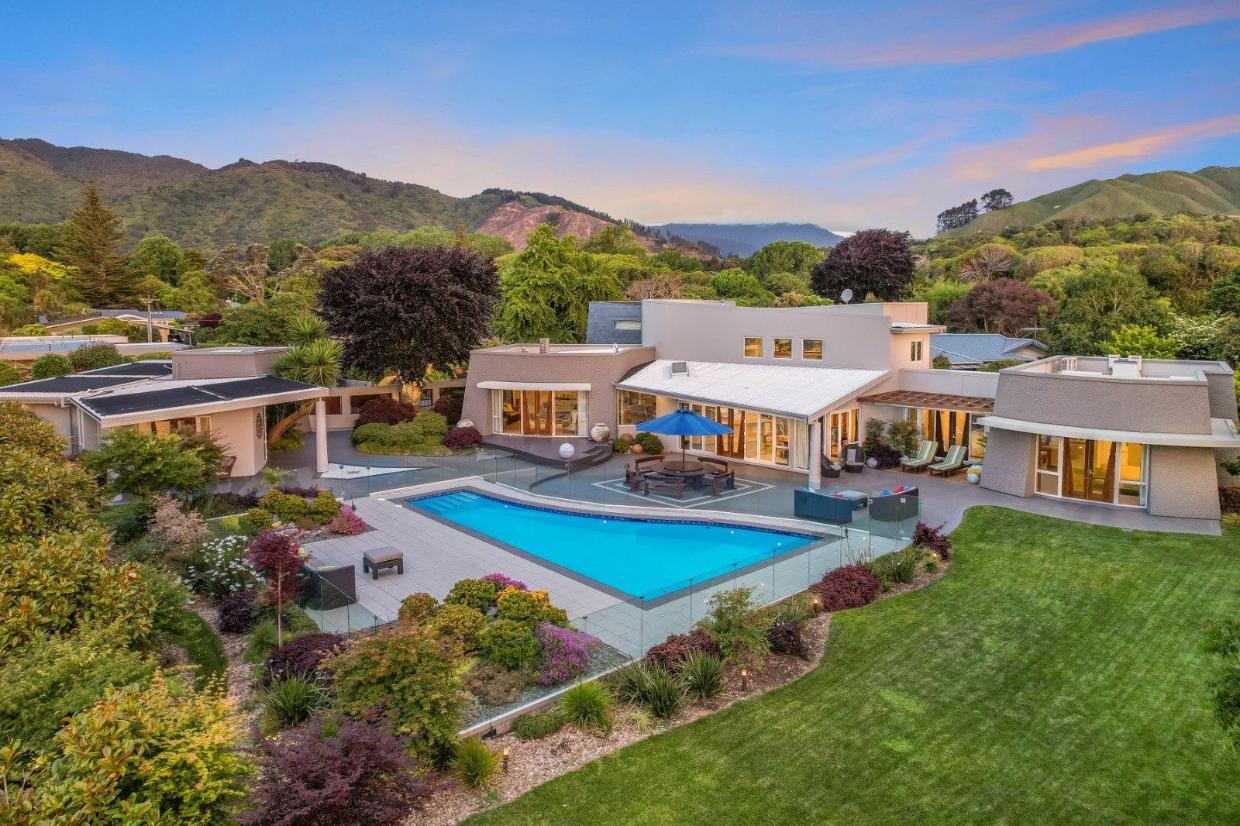 The two dwellings wrap around the swimming pool. Photo: TRADE ME/NZSIR