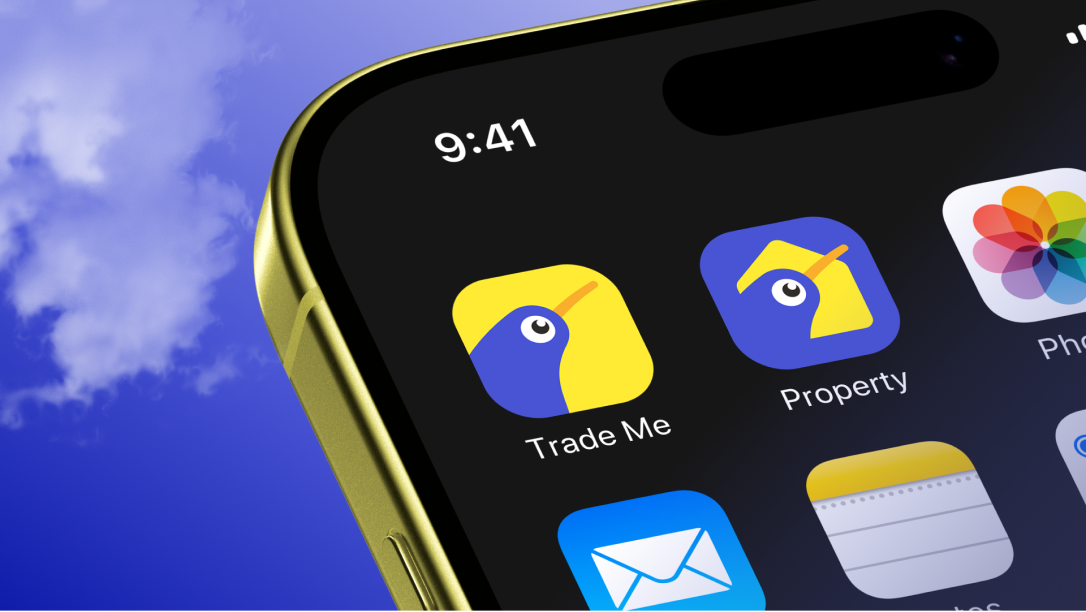 Close up of an iPhone with the Trade Me and Trade Me Property app icons