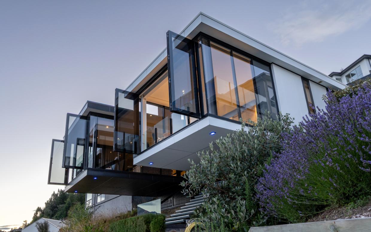Full-height glazing opens up the two wings of this Queenstown house designed by structural engineer Warrick Weber.