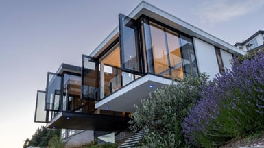 Full-height glazing opens up the two wings of this Queenstown house designed by structural engineer Warrick Weber.