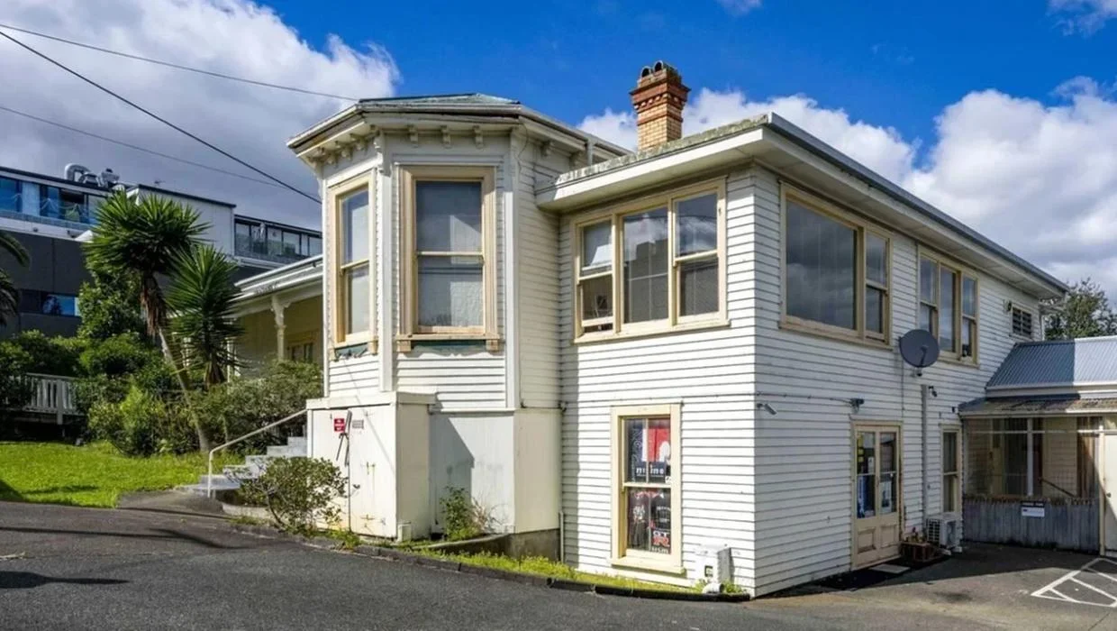 Exterior photo of dilapidated villa