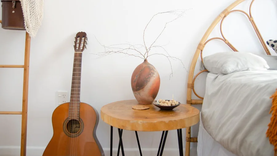 Bedroom interior with bedside table and guitar