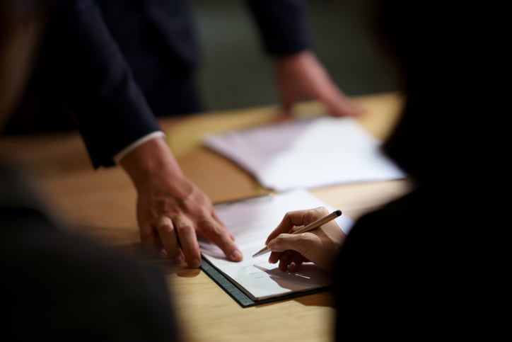 Lawyer helping client navigate a caveat on a property title.