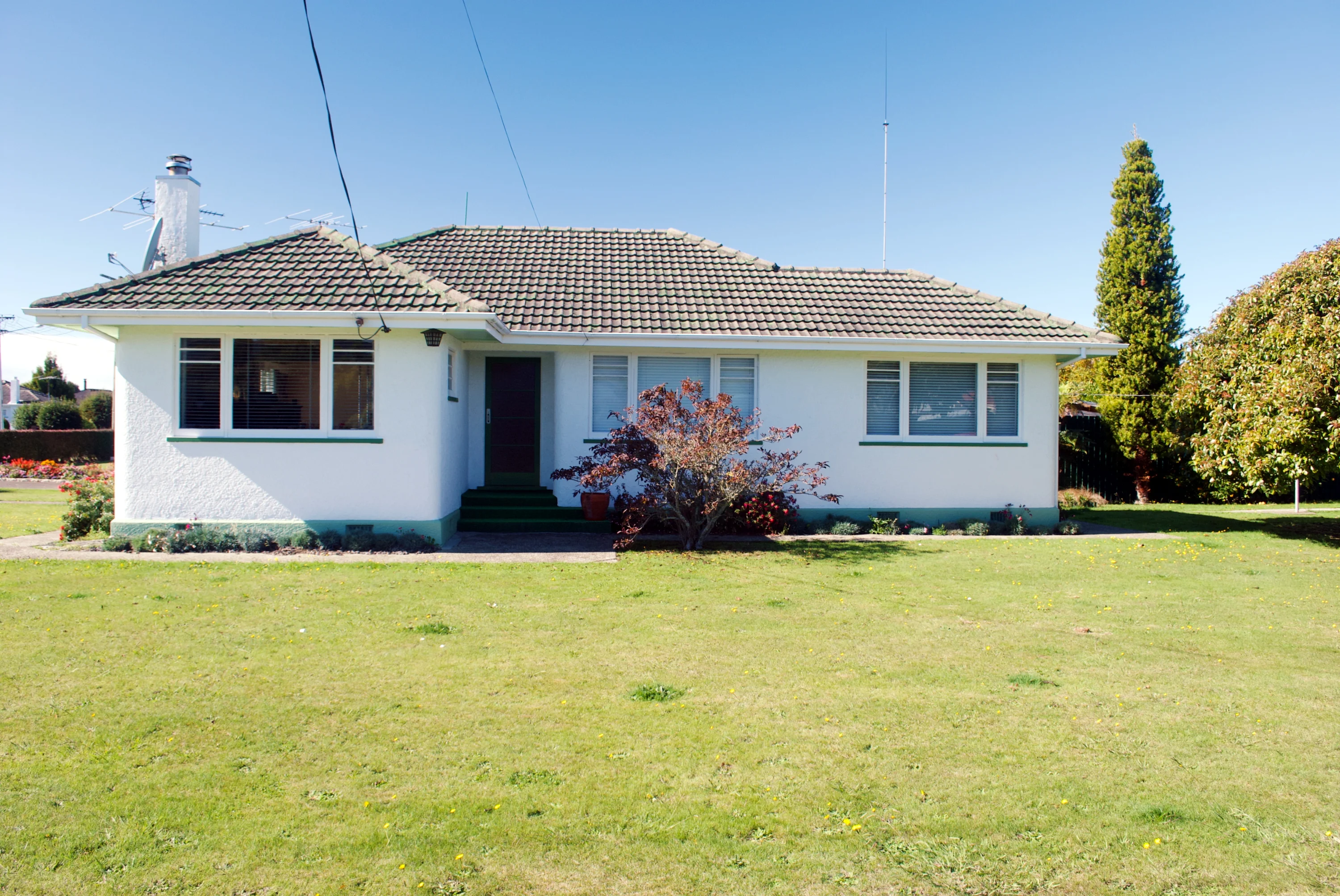 Typical bungalow popular in New Zealand and built in the 1950s or 60s.