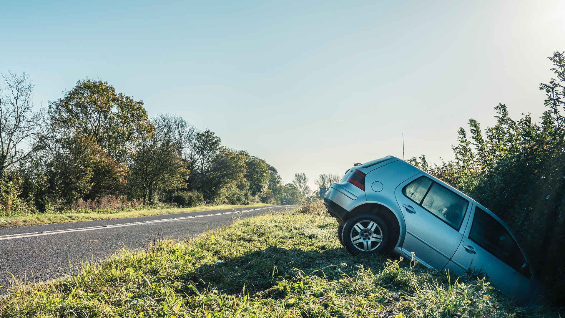small car crashed in ditch