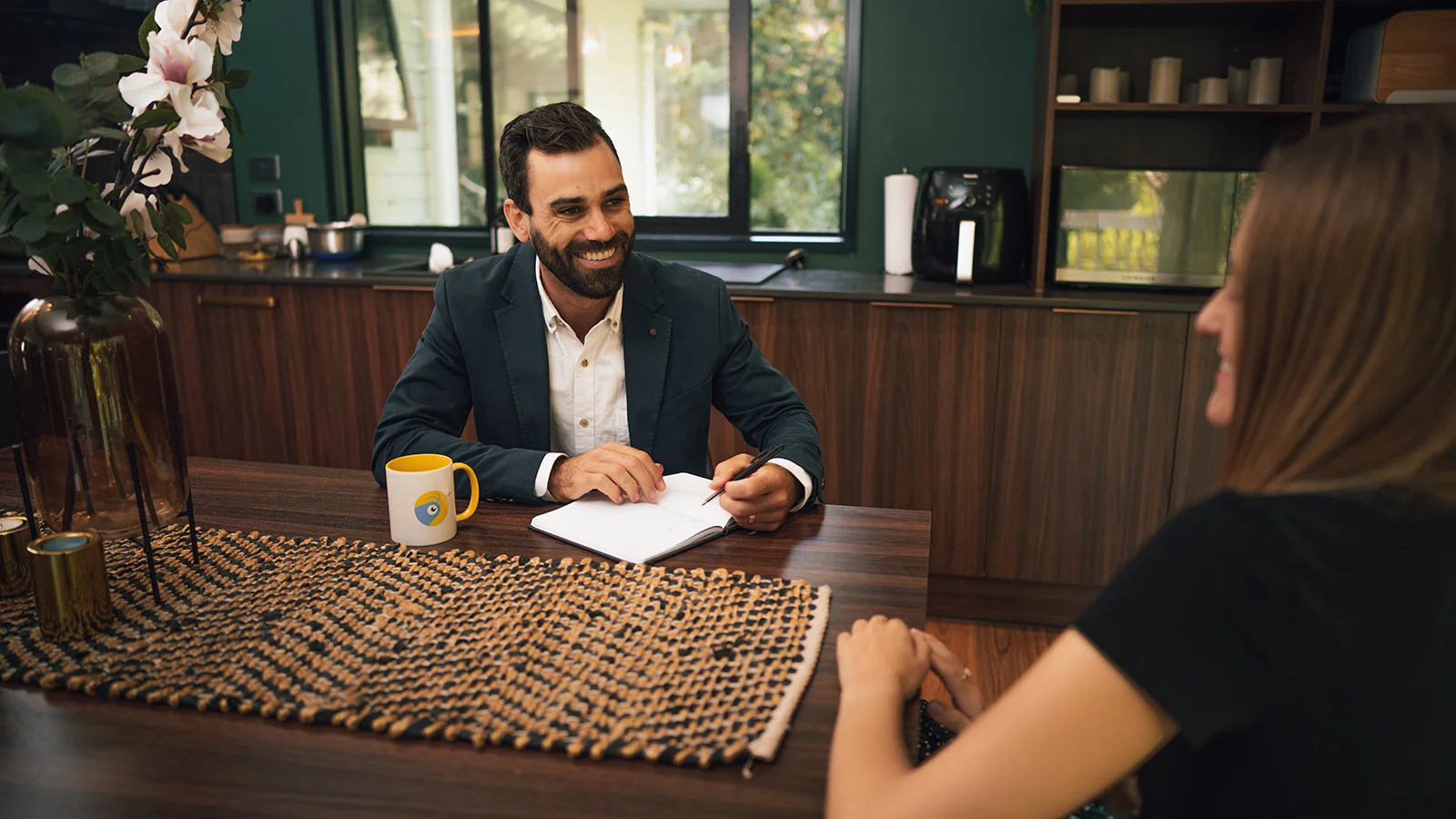 A mortgage broker helping a first home buyer understand mortgages