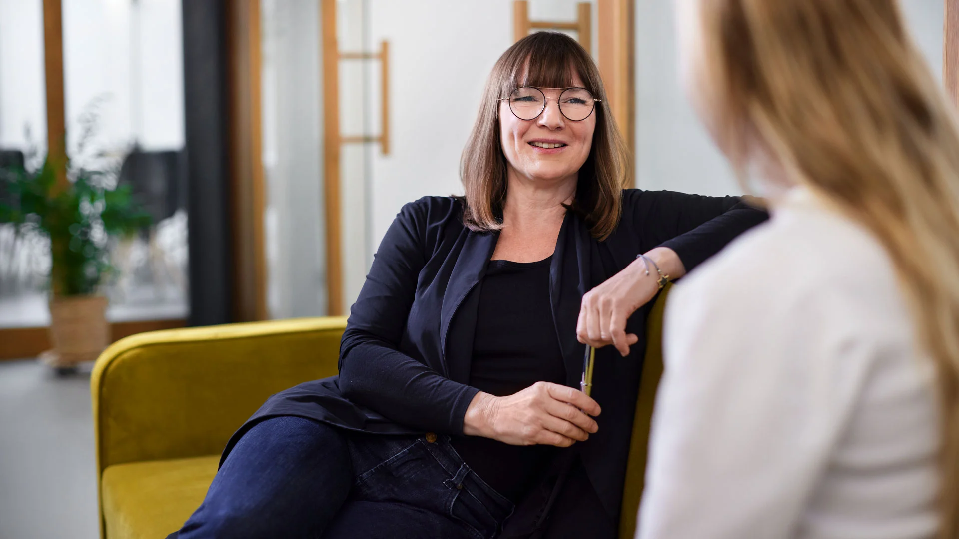 Employee discussing her page with her manager.
