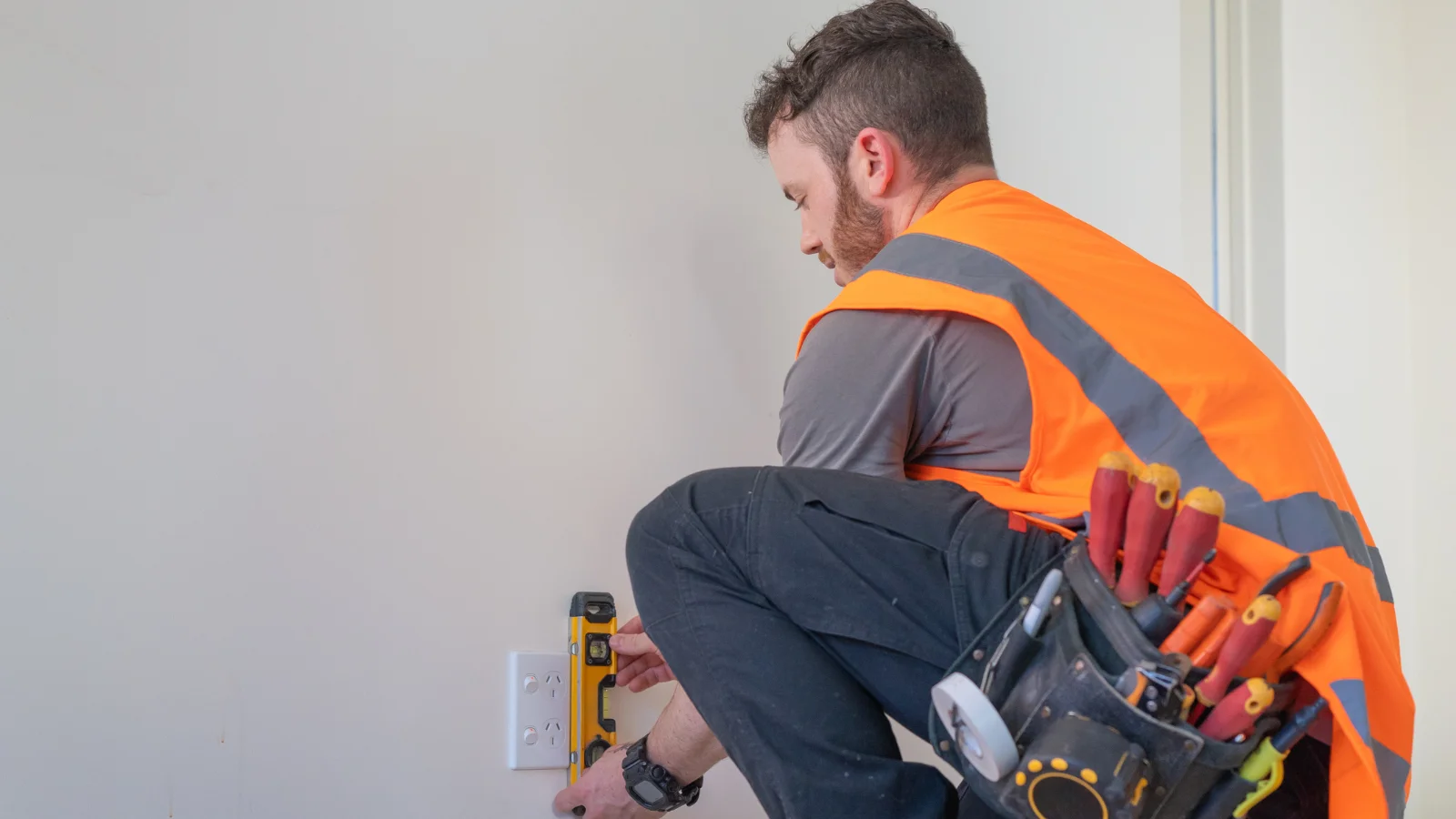 Man installing plug. Electrician. 